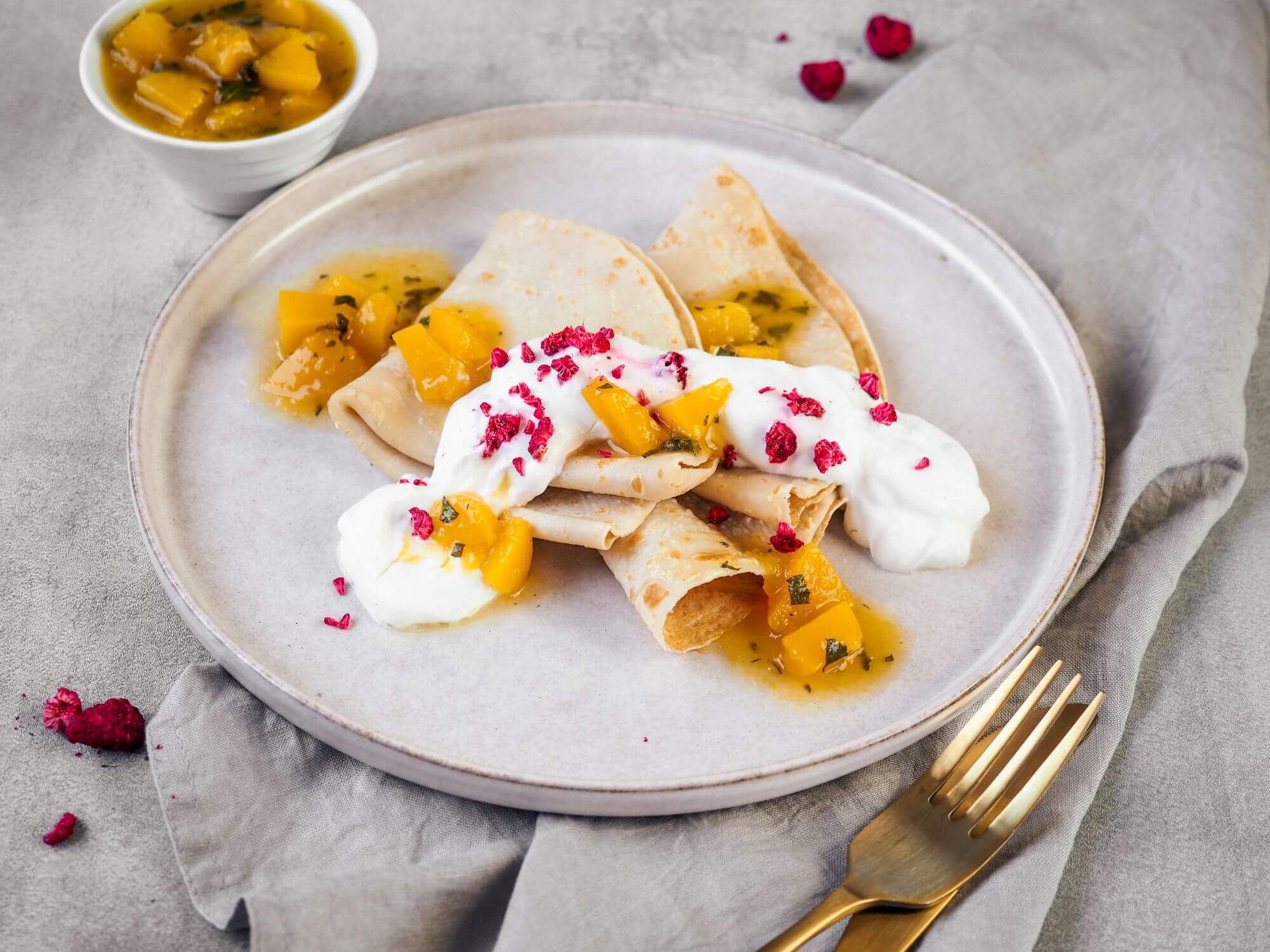 Pancakes with peach and mint sauce and sour cream